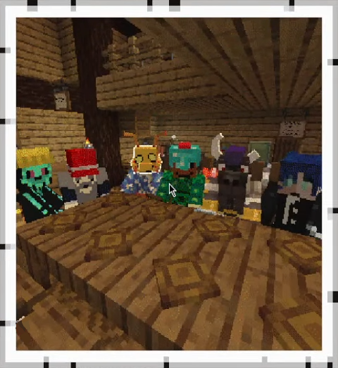 A Minecraft screenshot of each member of Team F sitting at a table, having family dinner.